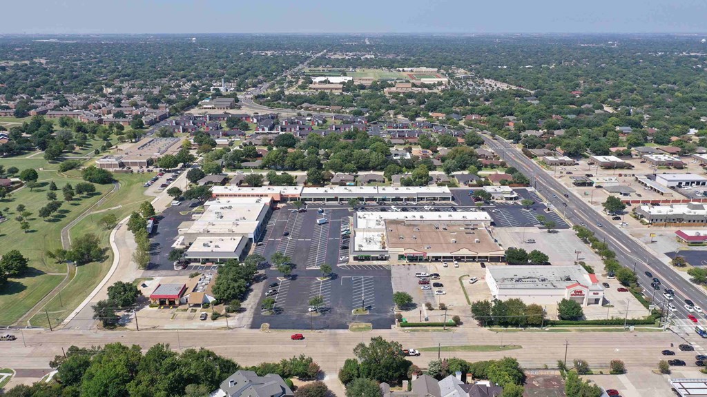 an aerial view of a parking lot in a city