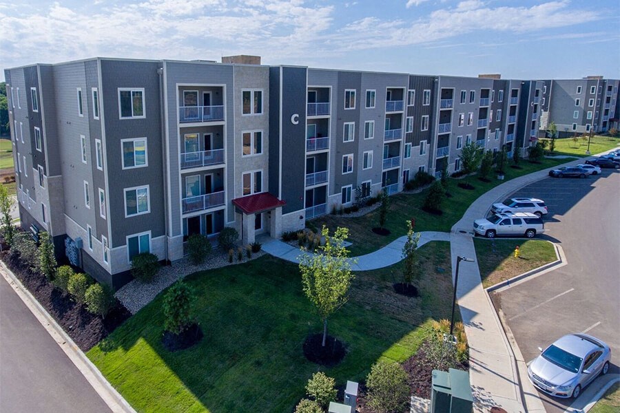 Fairway Flats - Mid-Rise Apartment Building with Lush Landscaping and Ample Parking