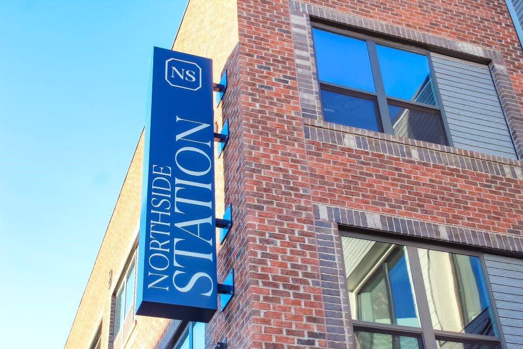 a building with a blue sign on the side of it