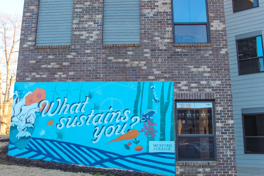 a mural on the side of a building that says what sustains you