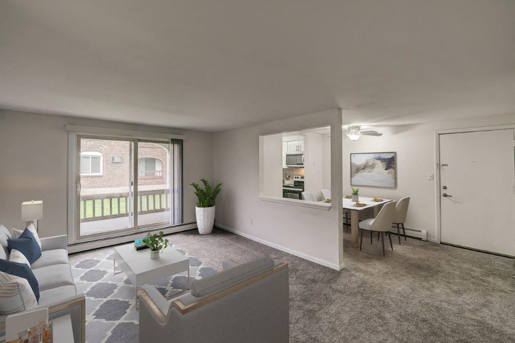 a living room and dining room with a couch and a table