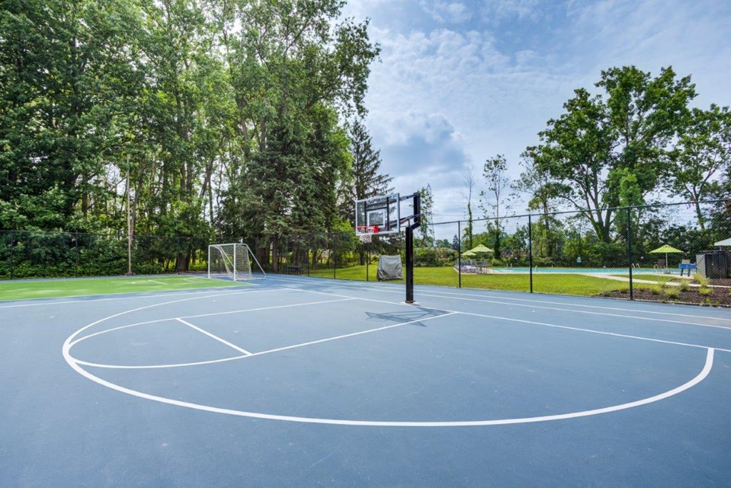 the basketball court is equipped with a net and a basketball hoop