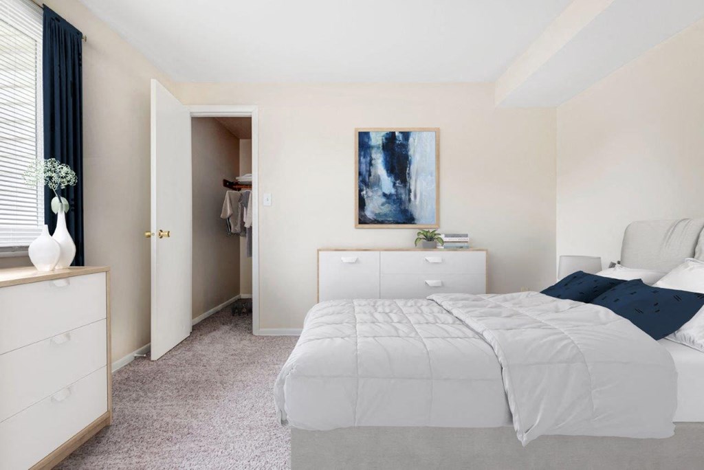a bedroom with a bed and a closet