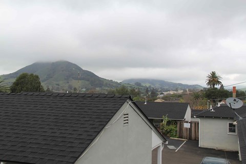 A view of a mountain from a rooftop.