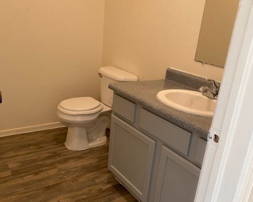 a bathroom with a toilet and a sink