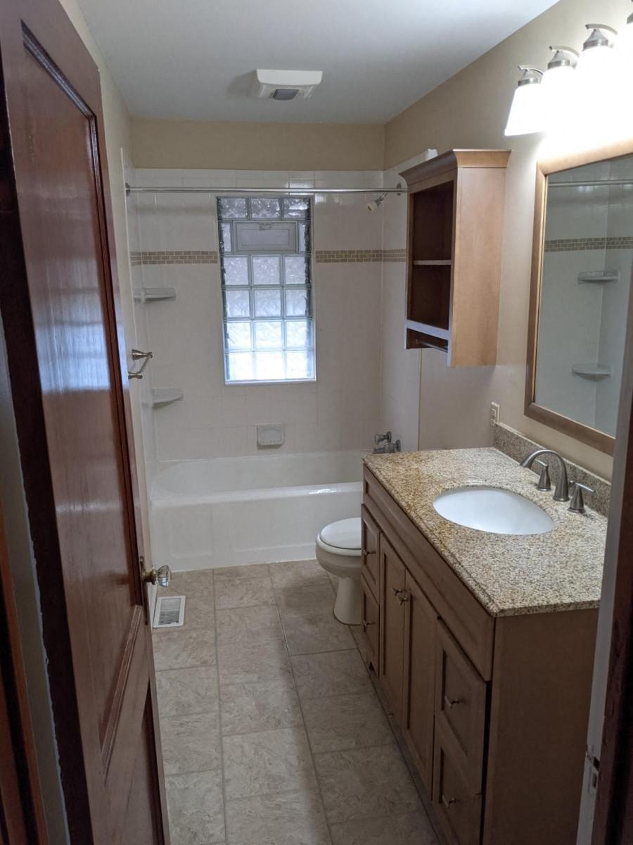 a bathroom with a sink toilet and a shower