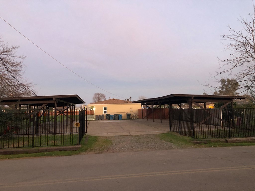 a house with a driveway and a gate