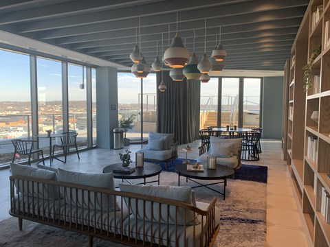 A modern living room with a view of the city.