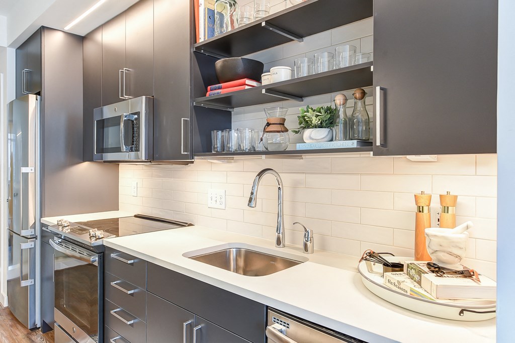a kitchen with stainless steel appliances and a sink