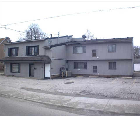 a large building with a street in front of it