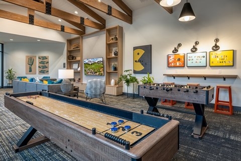 a games room with a pool table and foosball