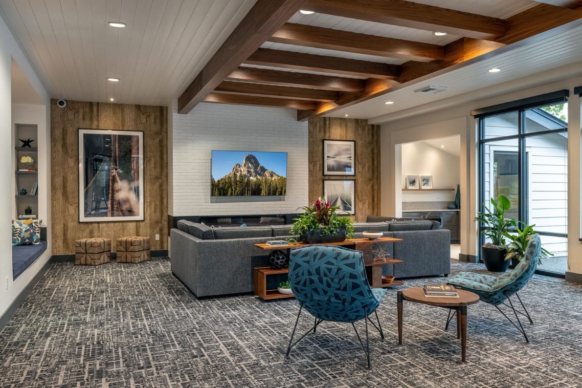 a living room with couches and chairs and a table