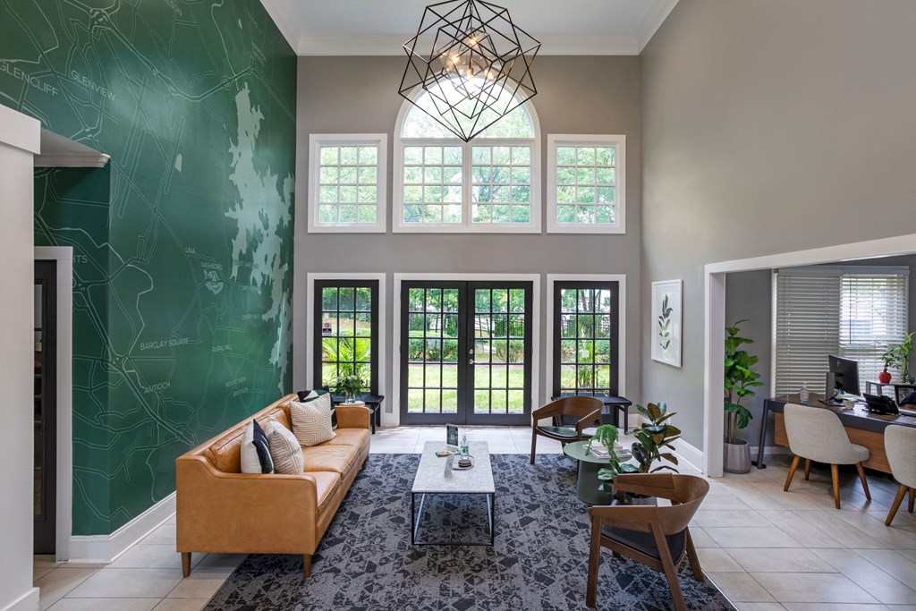 a living room with a green wall and a couch and a coffee table