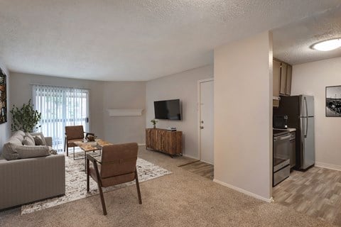 our apartments have a living room and a kitchen with a tv
