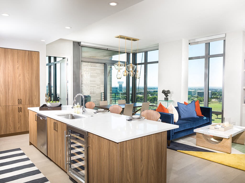 a kitchen and living room with a view of the city