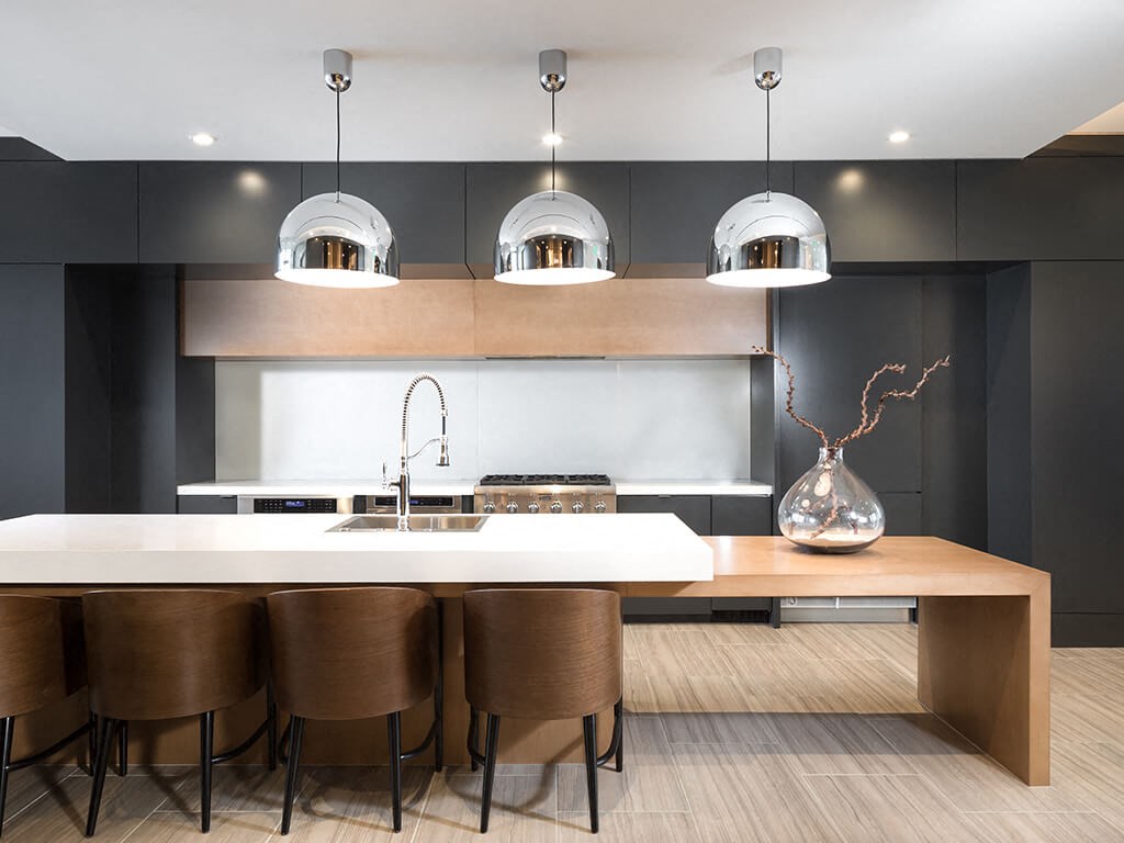 a large kitchen with a wooden table and chairs