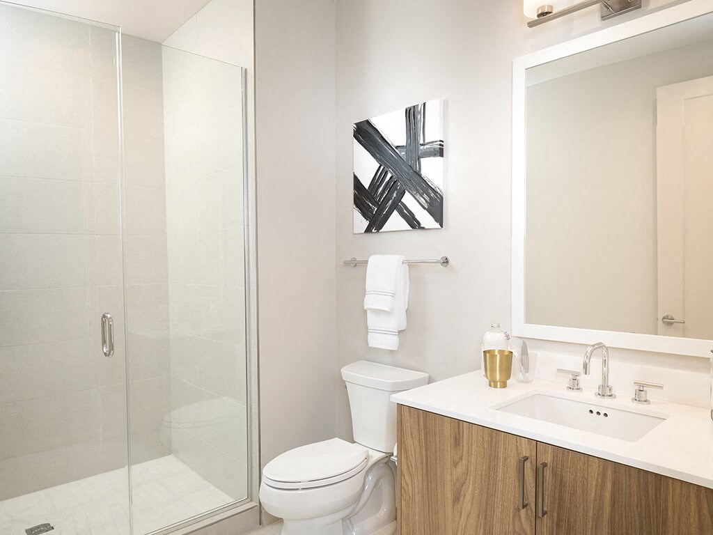 a bathroom with a toilet sink and a shower