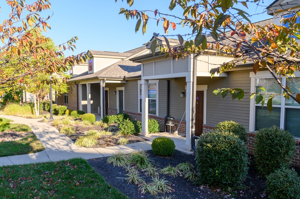 a house with a sidewalk in front of it