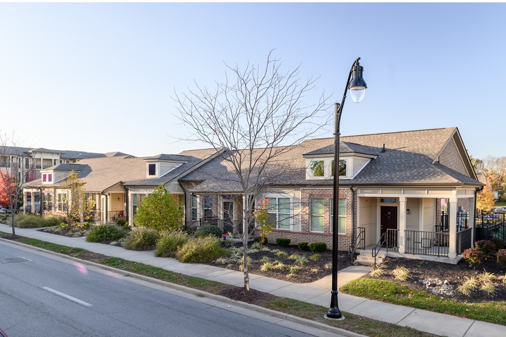 a row of houses on the side of a street
