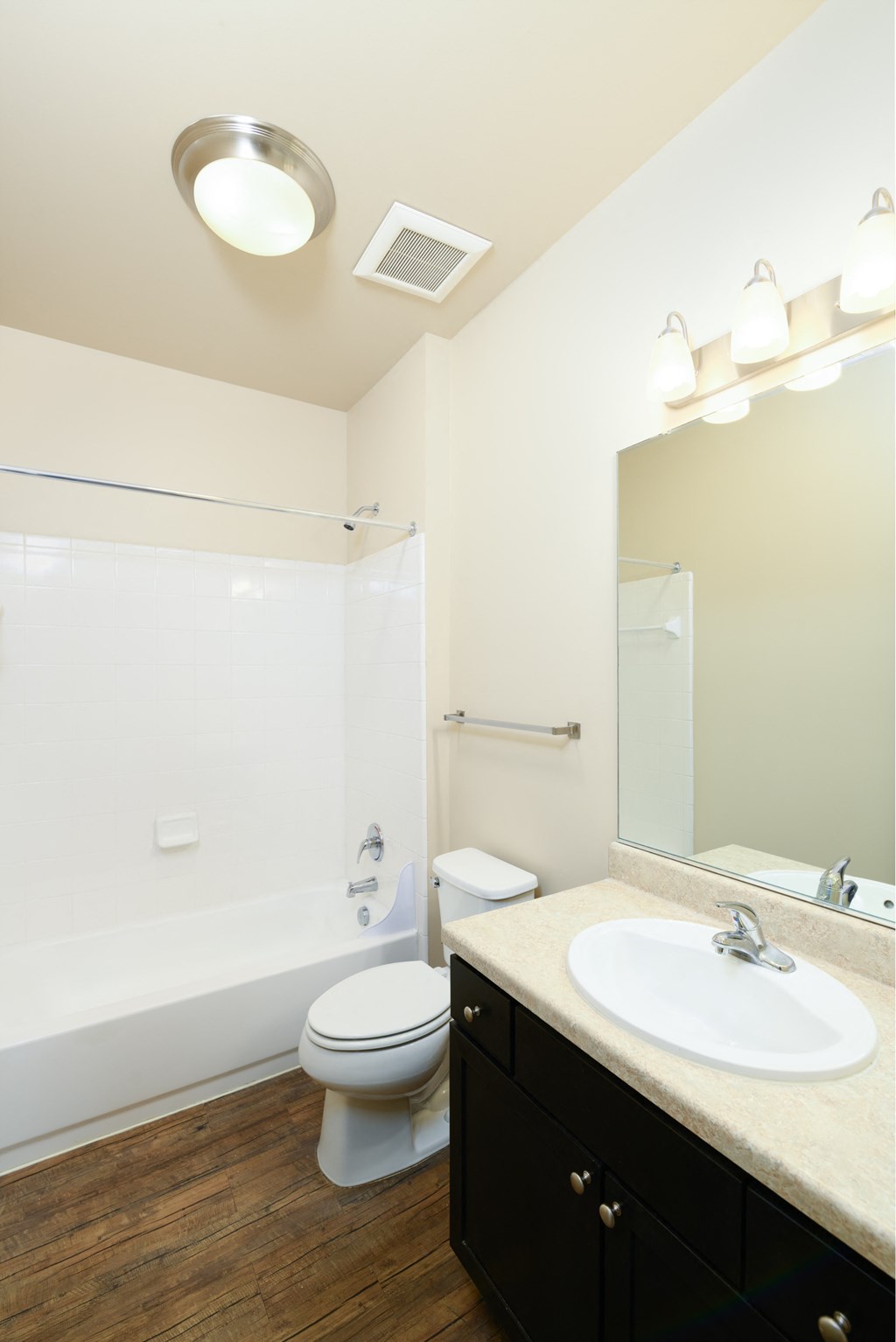 a bathroom with a toilet and a sink and a mirror