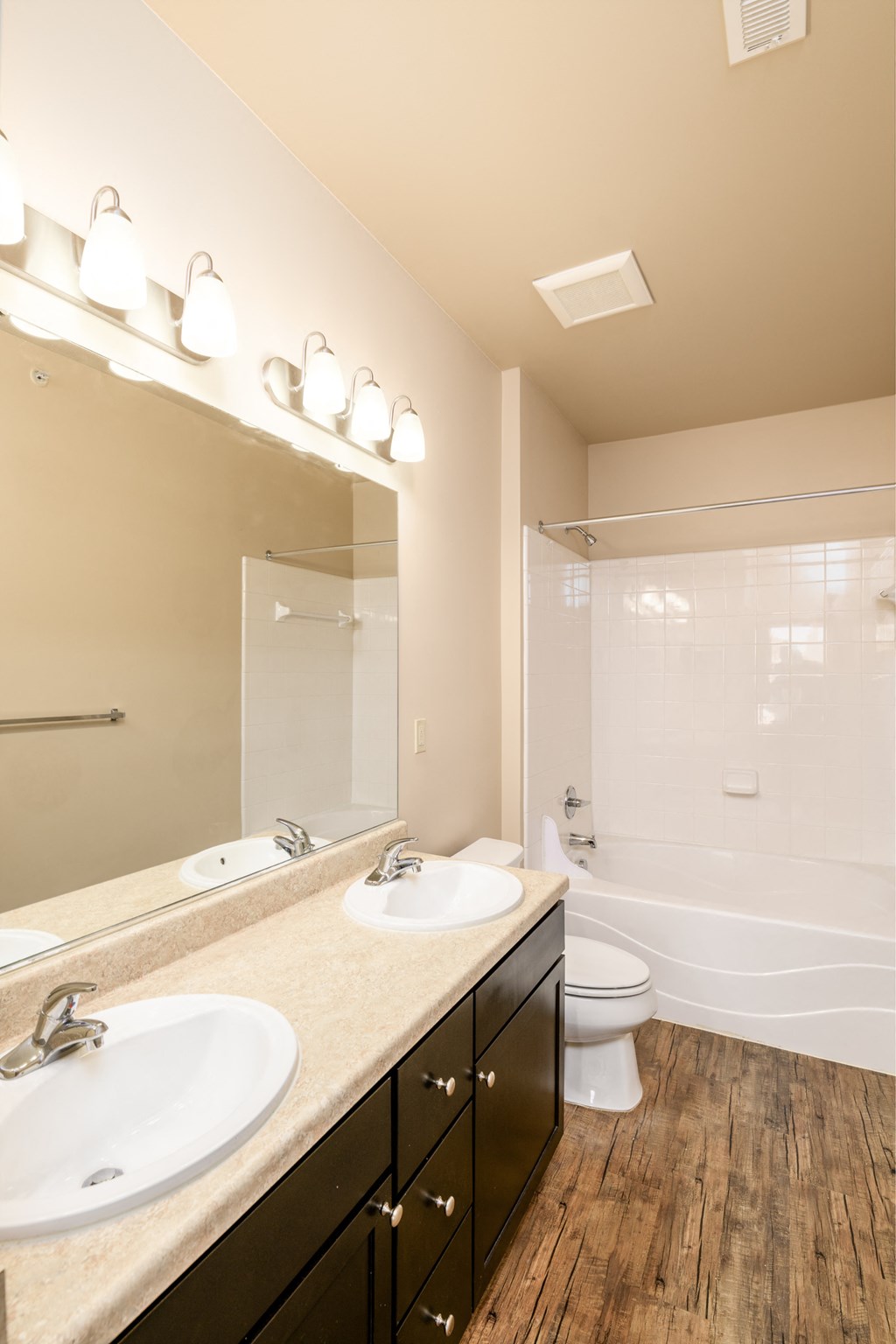 a bathroom with a sink and a toilet and a mirror