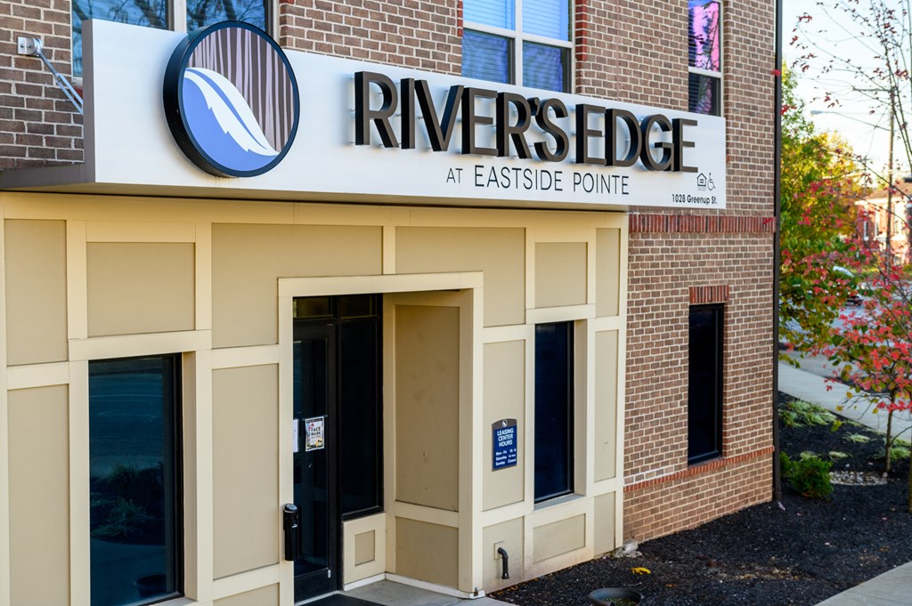 the front entrance of riverside at eastside pointe in front of a building