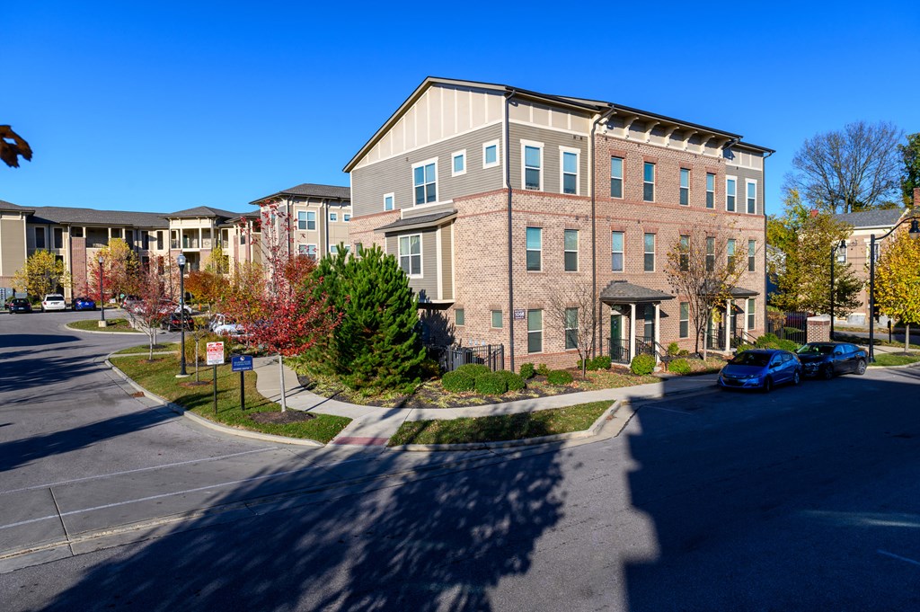 an apartment building on the corner of a street
