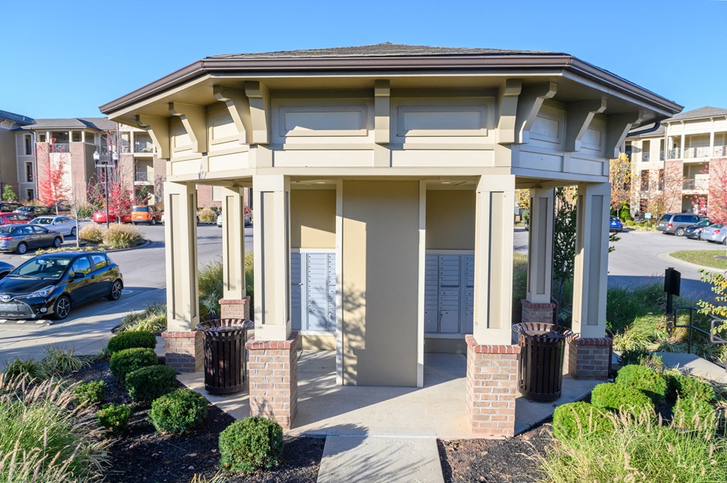 a building with a porch and a parking lot