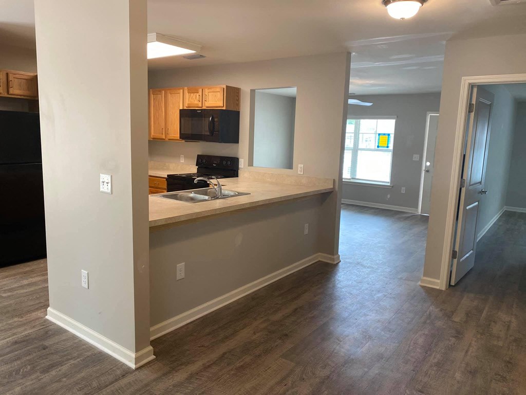 an empty kitchen and living room in a house