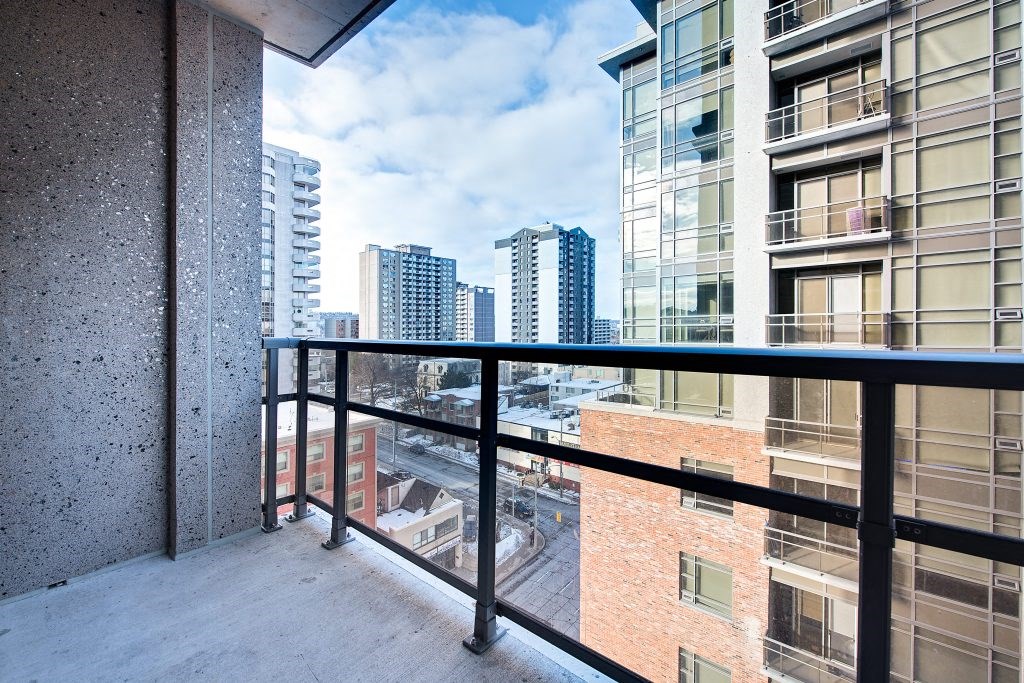 a balcony with a view of the city in the distance