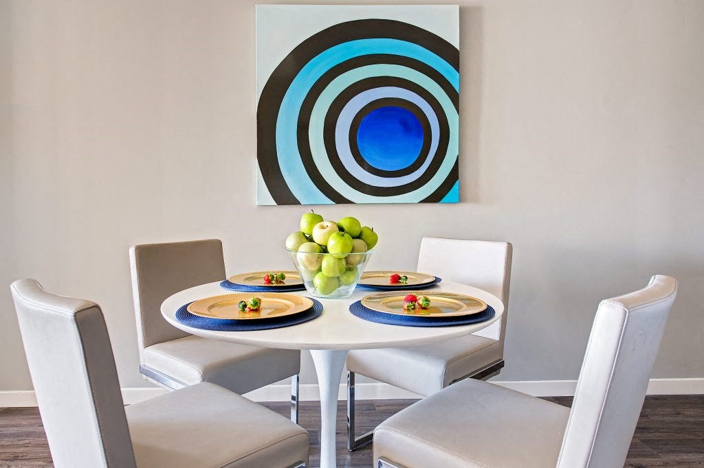 a dining room with a table and chairs