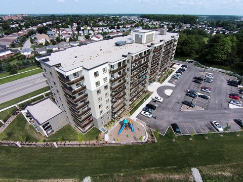 an aerial view of a building with a playground in front of it