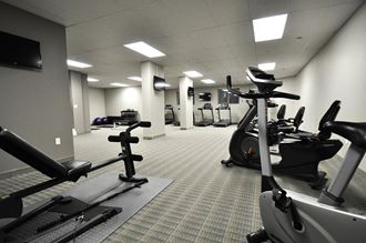 a gym filled with exercise equipment in a building