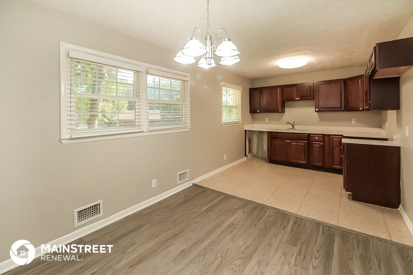 the kitchen and dining room of this manufactured home are spacious and clean