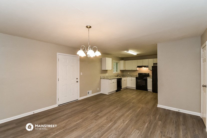 the living room and kitchen of an apartment