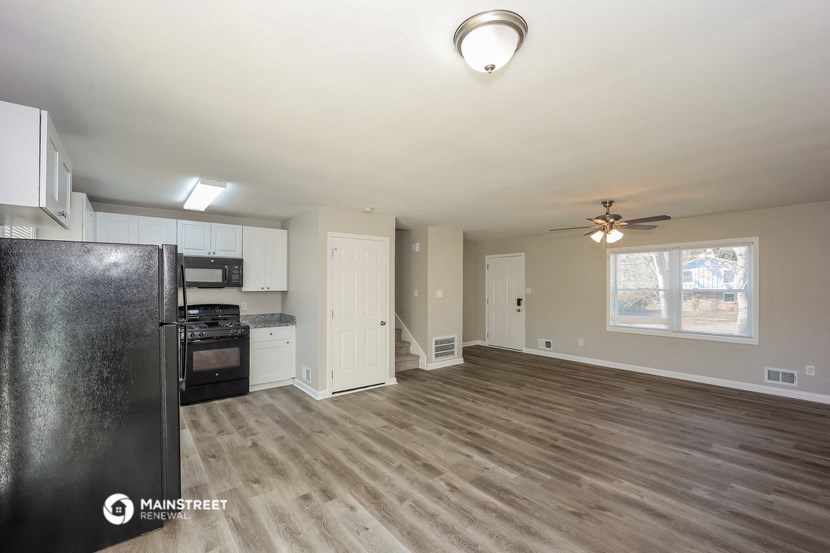 the kitchen and living room of an open floor plan