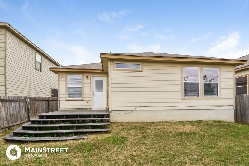 the exterior of a house with a porch and stairs