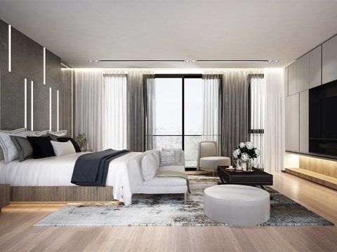 A modern bedroom with a large bed and a white chair.