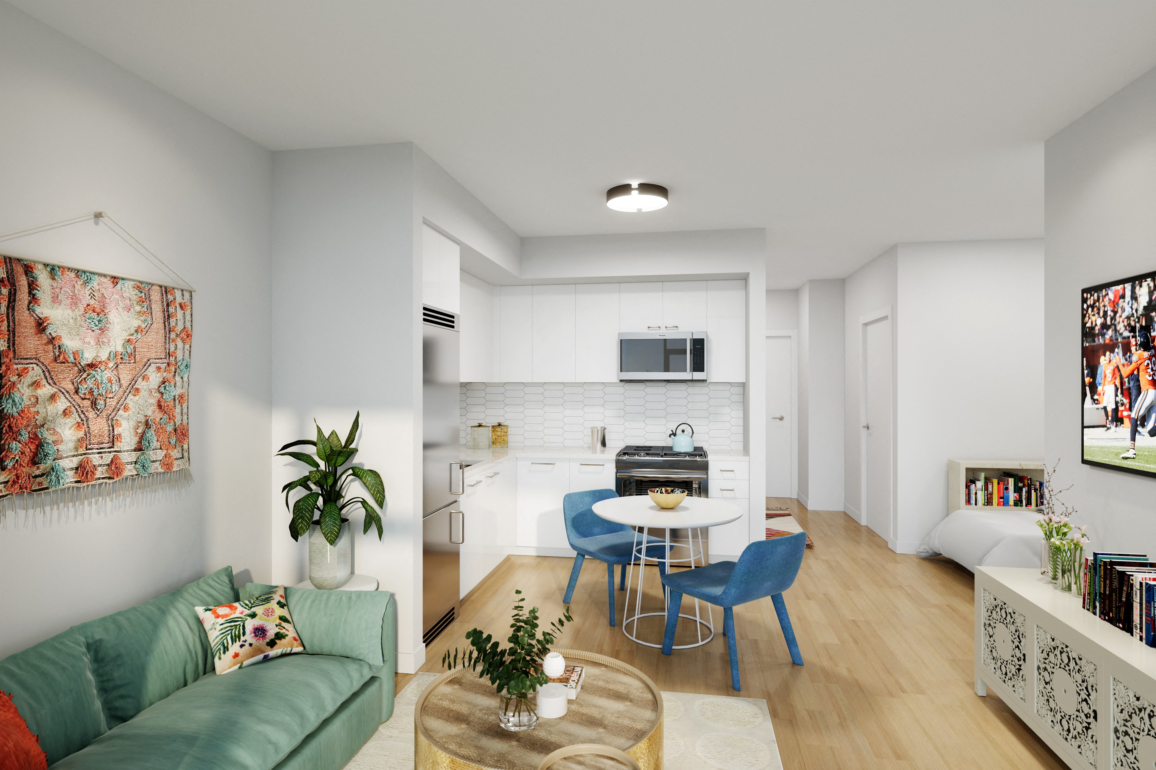 a living room and kitchen with a green couch and blue chairs