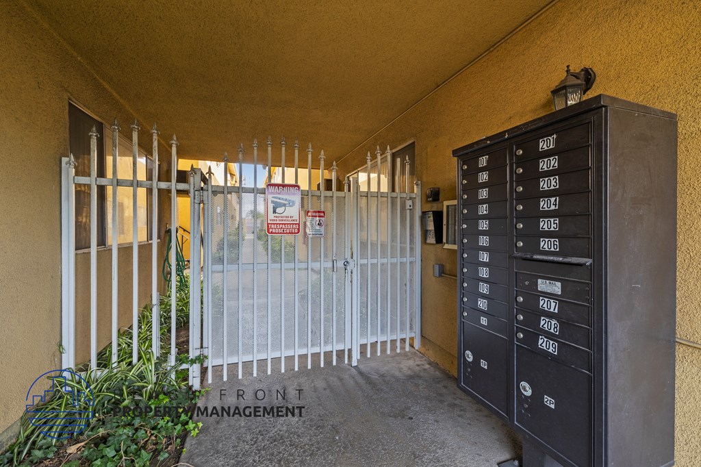 the building with a gate and lockers in front of it