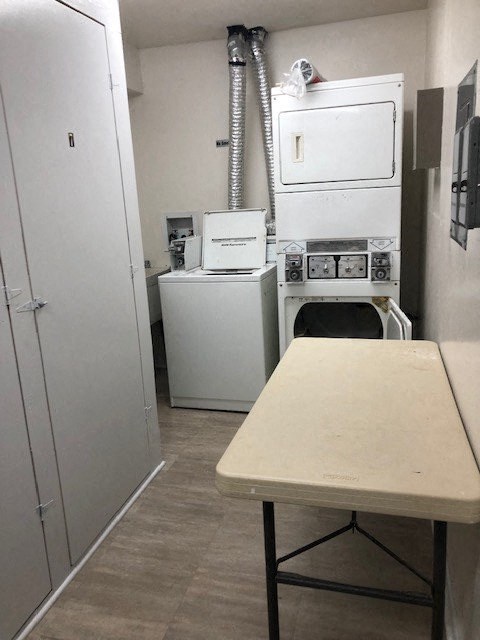 a small kitchen with a table and a stove