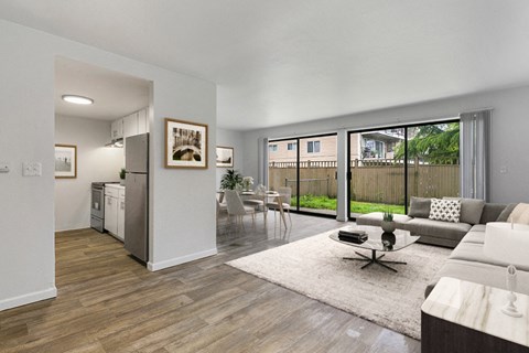 A modern living room with a white couch and a coffee table.