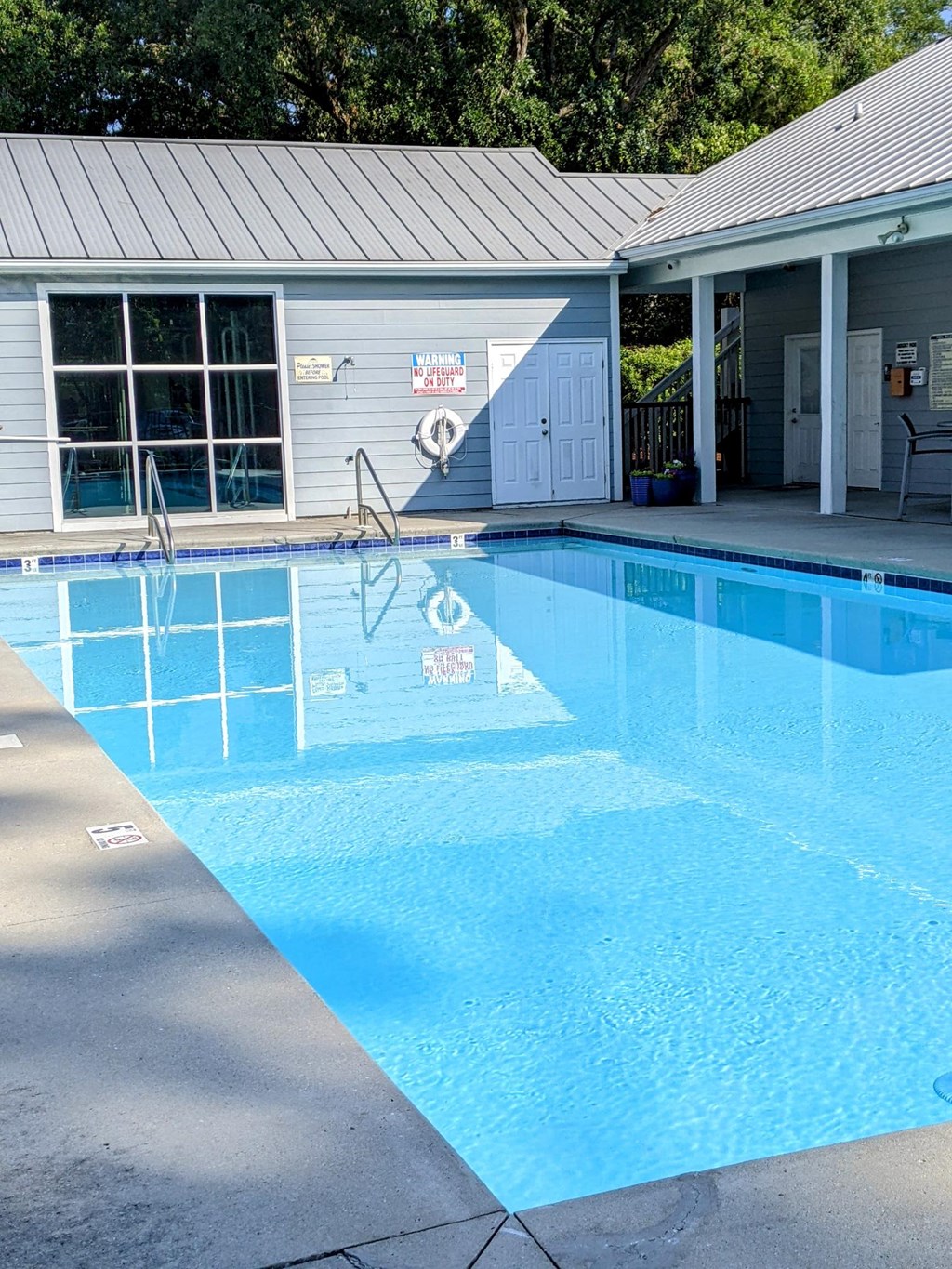 a large pool in front of a building