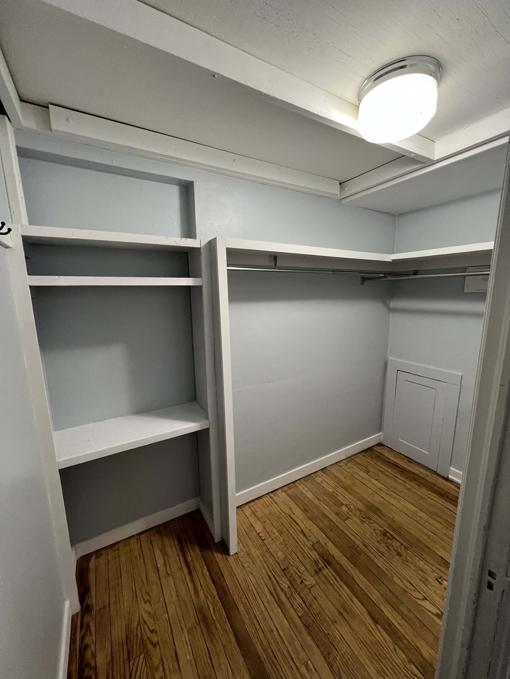 a room with shelves and a light in it