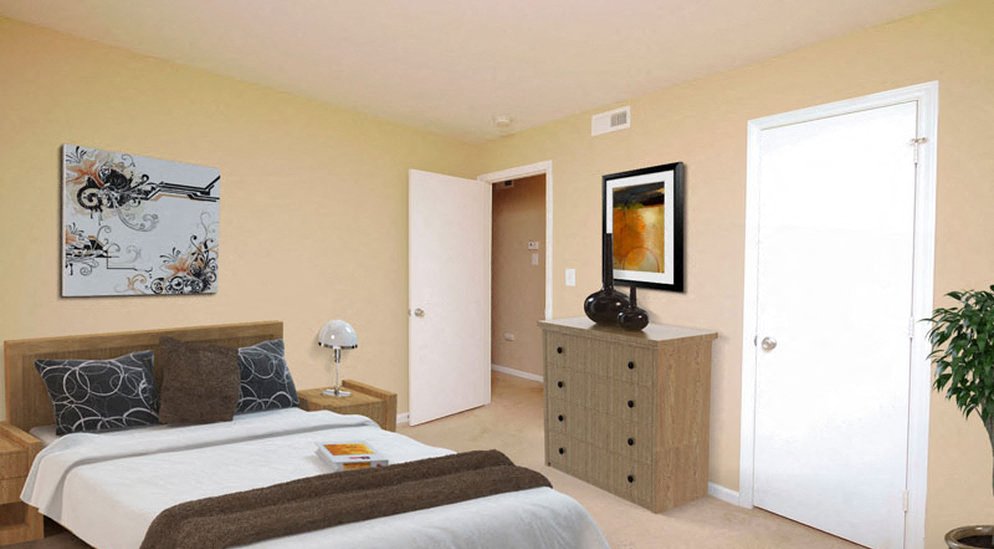 a bedroom with a bed and a dresser