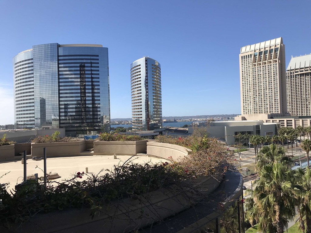 a view of the city skyline from the roof of a building