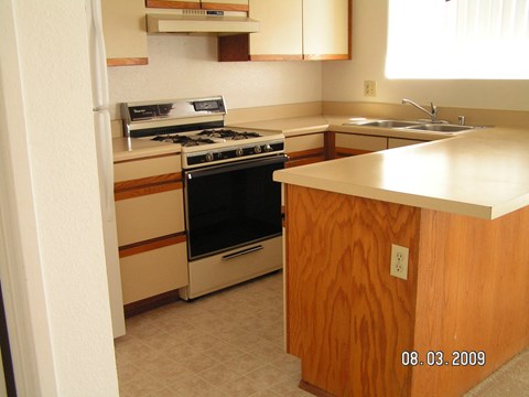 A kitchen with a stove and oven.