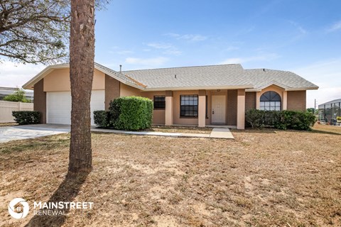 a house with a yard and a tree