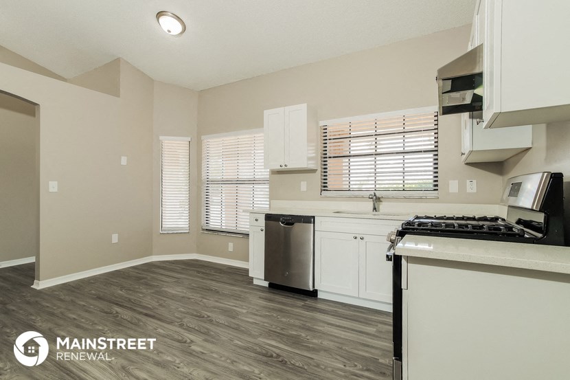 the kitchen and living room of an apartment