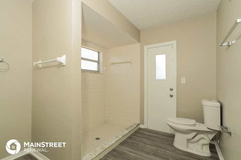 a small bathroom with a toilet and a shower